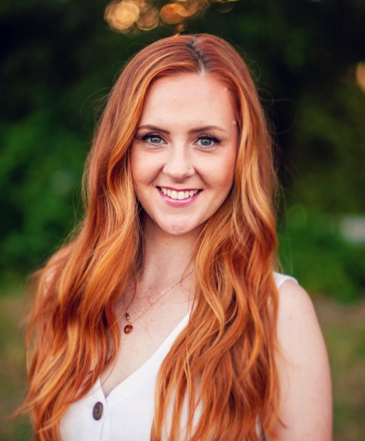 Hanna J of Modern Beautician with long copper-red hair